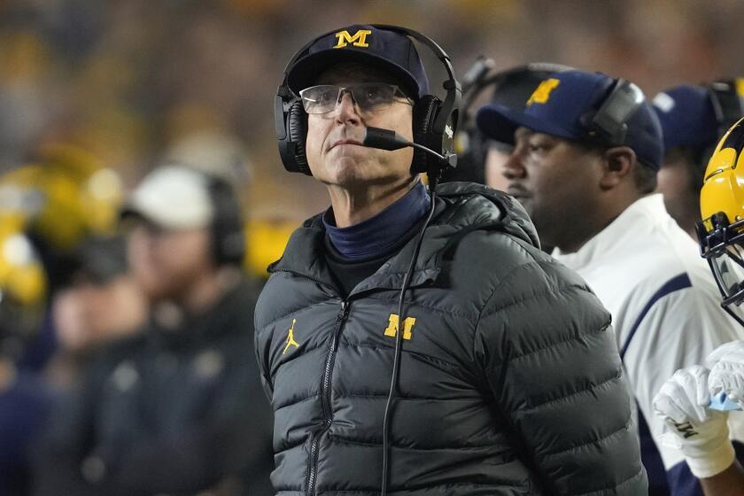 Michigan head coach Jim Harbaugh watches against Purdue in the first half.