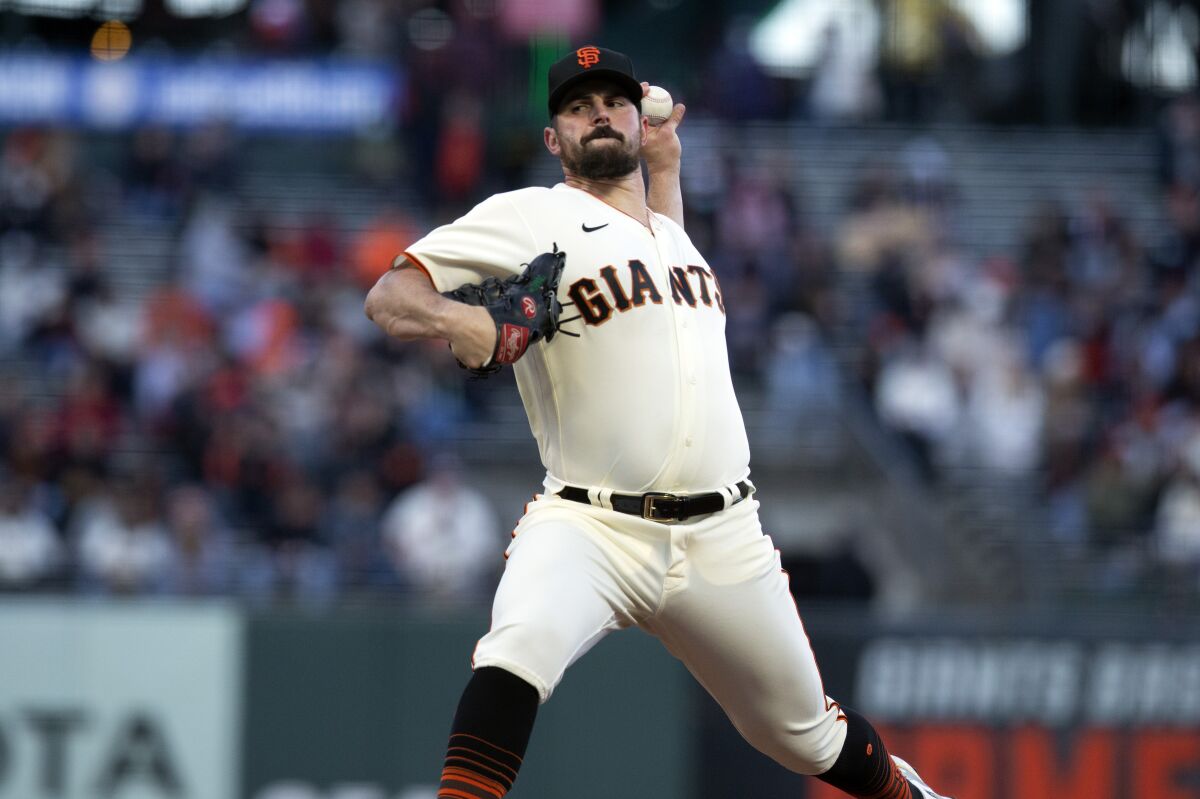 San Francisco Giants starting pitcher Carlos Rodon delivers against the Colorado Rockies during the second inning of a baseball game, Monday, May 9, 2022, in San Francisco. (AP Photo/D. Ross Cameron)