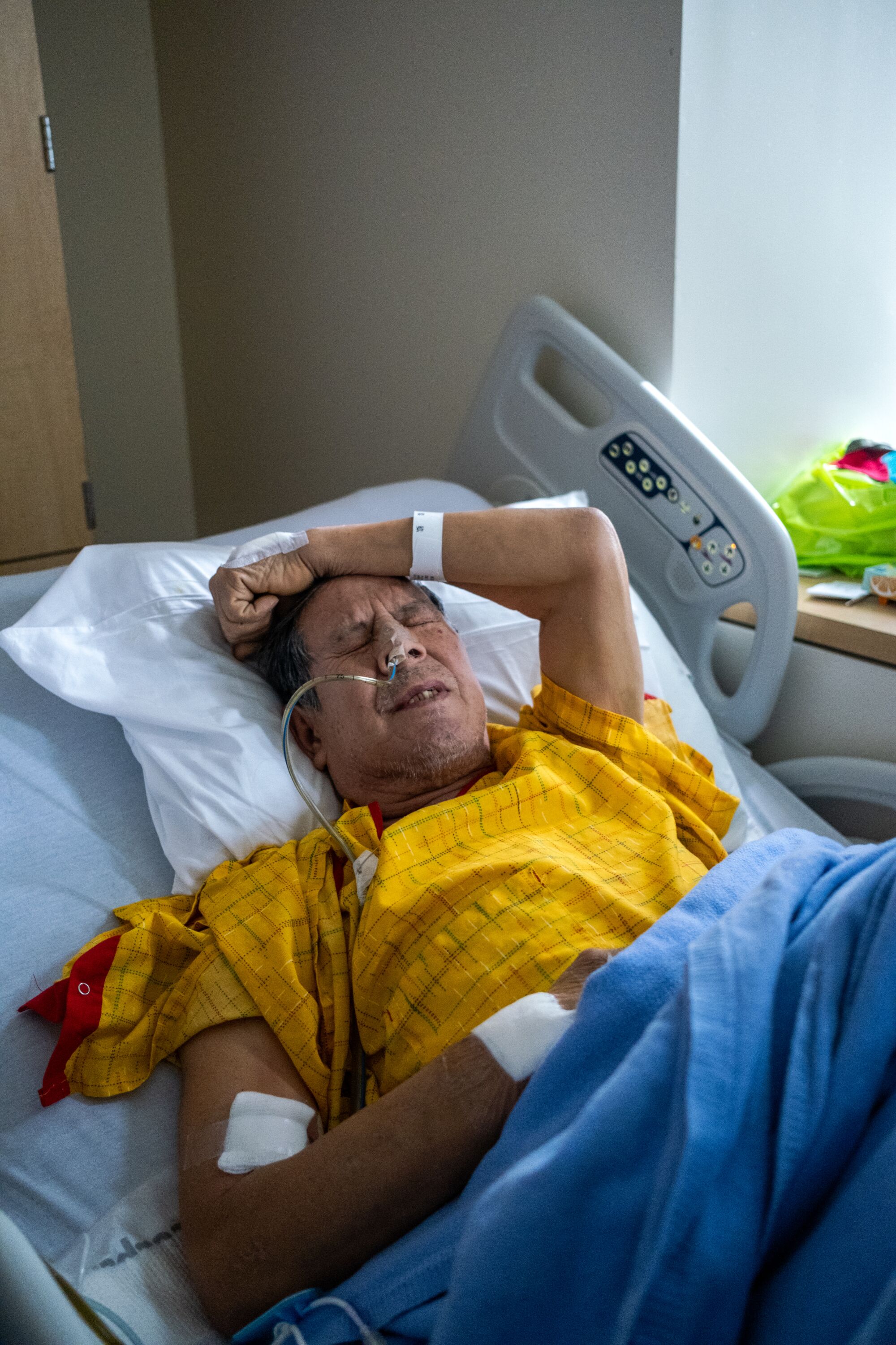 Ernesto Chavez, 65, is in a considerable amount of pain as he waits to be transferred to a different hospital.
