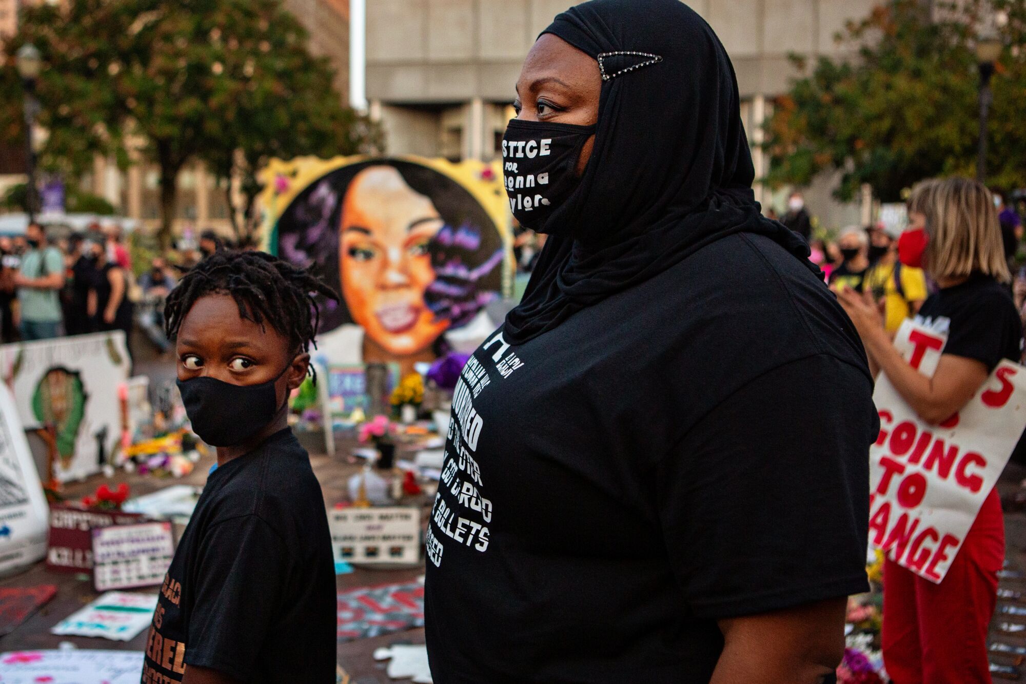 A mother and son at a Louisville demonstration.
