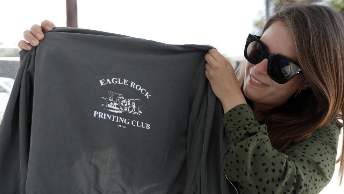 Alexandra Bolinder-Gibsand, 29, of Los Feliz displays a jacket she had screenprinted at Cooper's May 4 event.