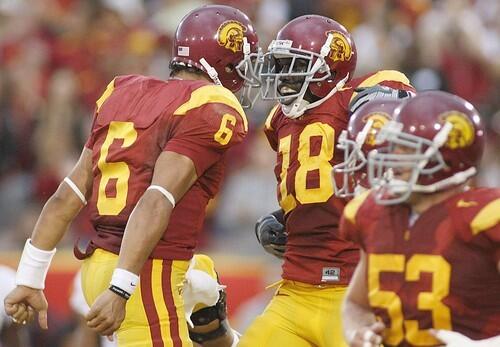 USC quarterback Mark Sanchez (6) celebrates a touchdown pass with receiver Damian Williams in the second quarter on Saturday.