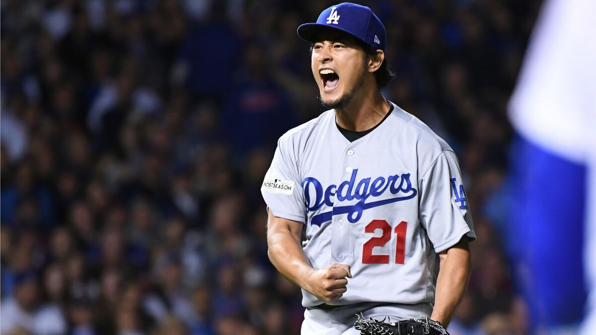Yu Darvish celebrates after turning a double play to end the inning.