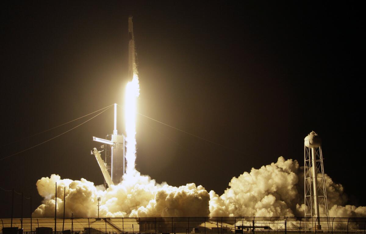 The Falcon 9 rocket with the Crew Dragon space capsule on board lifts off at the Kennedy Space Center in Florida early Saturday.