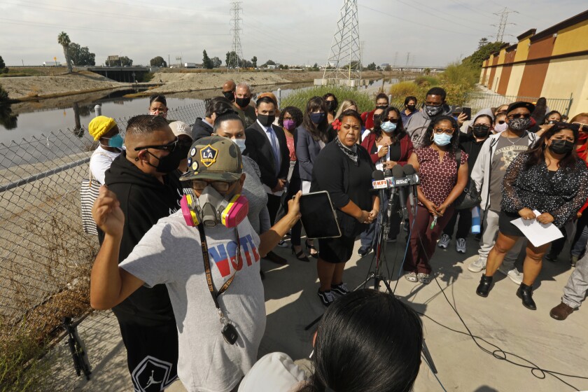 Carson residents gather during a press conference regarding toxic fumes coming from Dominguez Channel.
