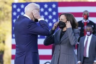 President Joe Biden and Vice President Kamala Harris put on their face masks after speaking in support of changing the Senate filibuster rules that have stalled voting rights legislation, at Atlanta University Center Consortium, on the grounds of Morehouse College and Clark Atlanta University, Tuesday, Jan. 11, 2022, in Atlanta. (AP Photo/Patrick Semansky)
