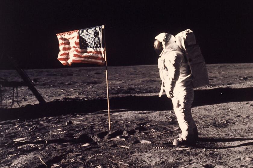 FILE - In this image provided by NASA, astronaut Buzz Aldrin poses for a photograph beside the U.S. flag deployed on the moon during the Apollo 11 mission on July 20, 1969. Television is marking the 50th anniversary of the July 20, 1969, moon landing with a variety of specials about NASA's Apollo 11 mission. (Neil A. Armstrong/NASA via AP, File)