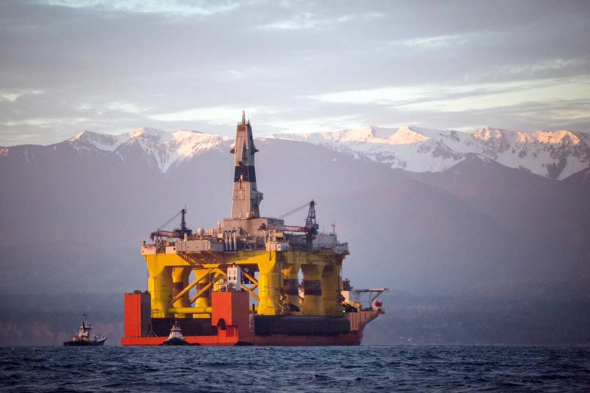 An oil drilling rig arrives aboard a transport ship in Port Angeles, Wash., on April 17.