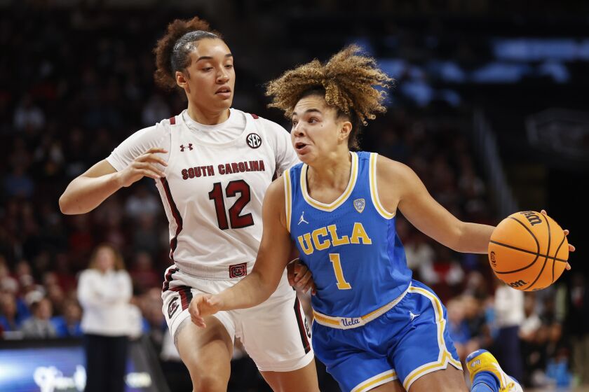 UCLA guard Kiki Rice (1) drives to the basket against South Carolina guard Brea Beal (12) during the first half of an NCAA college basketball game in Columbia, S.C., Tuesday, Nov. 29, 2022. (AP Photo/Nell Redmond)