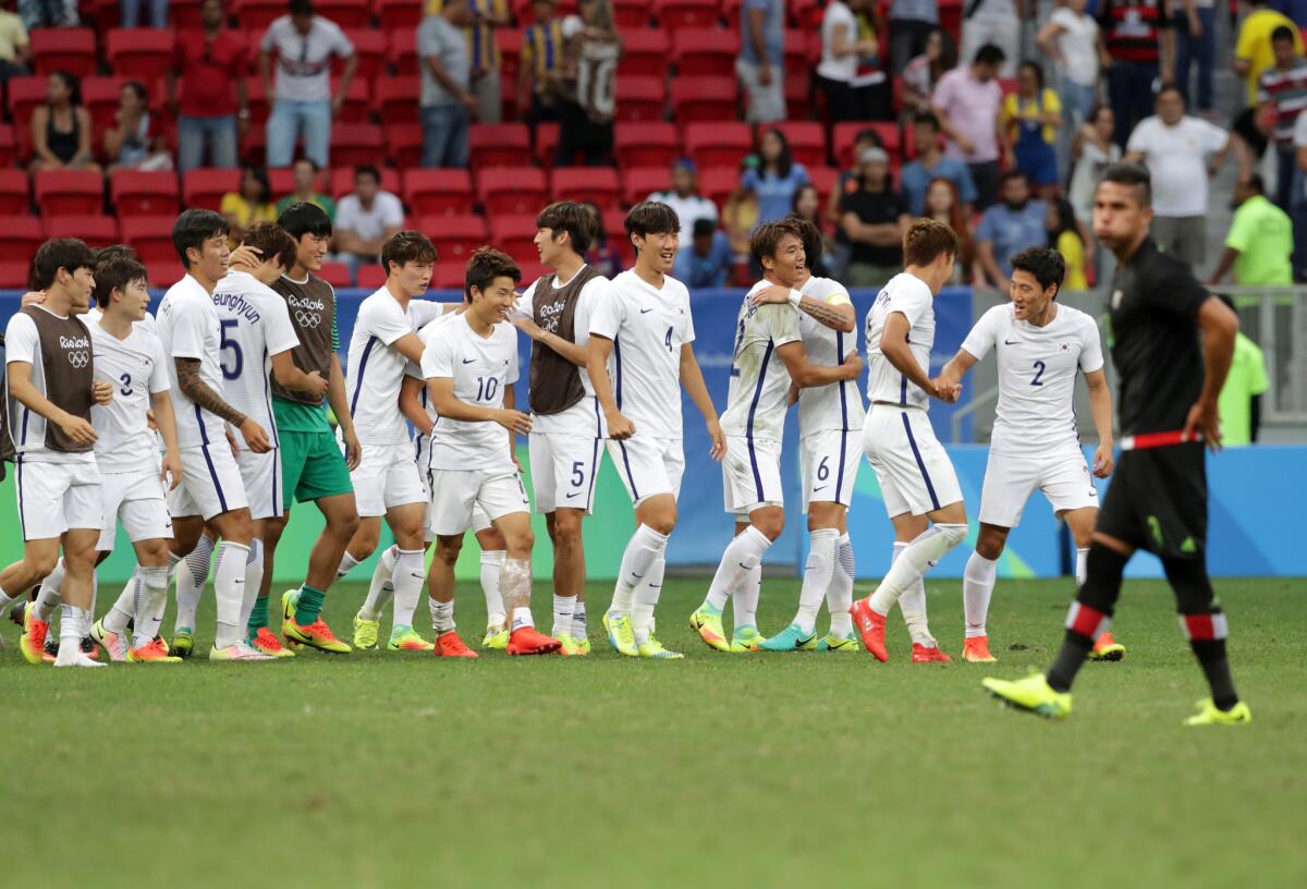 South Korea players celebrate after defeat Mexico 1-0 on a group C match of the men's Olympic football tournament at the National Stadium in Brasilia, Brazil, Wednesday, Aug. 10, 2016. (AP Photo/Eraldo Peres)