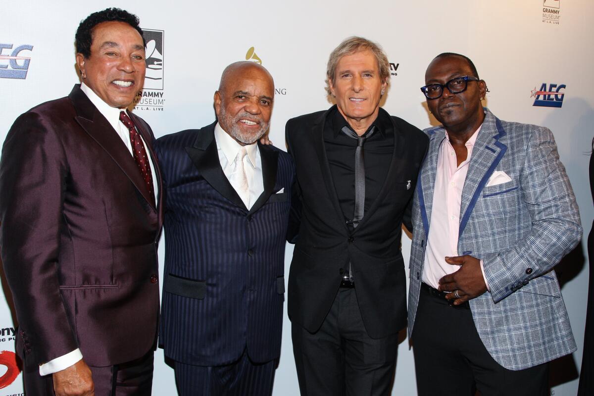 Smokey Robinson, left, Berry Gordy Jr., Michael Bolton and Randy Jackson arrive at the Grammy Museum gala tribute concert on Nov. 11, 2013, in Los Angeles.