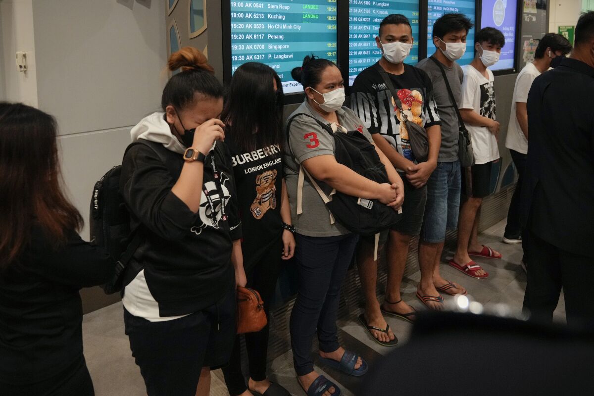 A group of young people at an airport