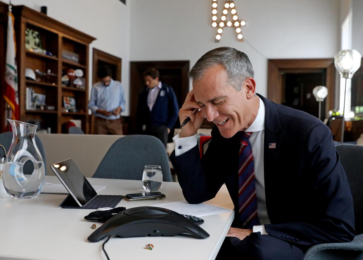 L.A. Mayor Eric Garcetti, holds an interview in his office, after President Joe Biden selected him as his nominee 