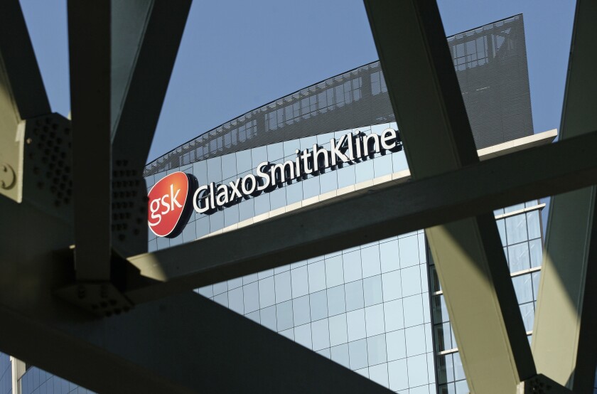 FILE - The offices of pharmaceutical firm GlaxoSmithKline, in London, April 20, 2009. The pharmaceutical giant GlaxoSmithKline said Saturday Jan. 15, 2022, it has rejected an unsolicited 50 billion-pound ($68.4 billion) bid from Unilever for its consumer healthcare goods unit, a joint venture it controls in a partnership with Pfizer. (AP Photo/Sang Tan, File)