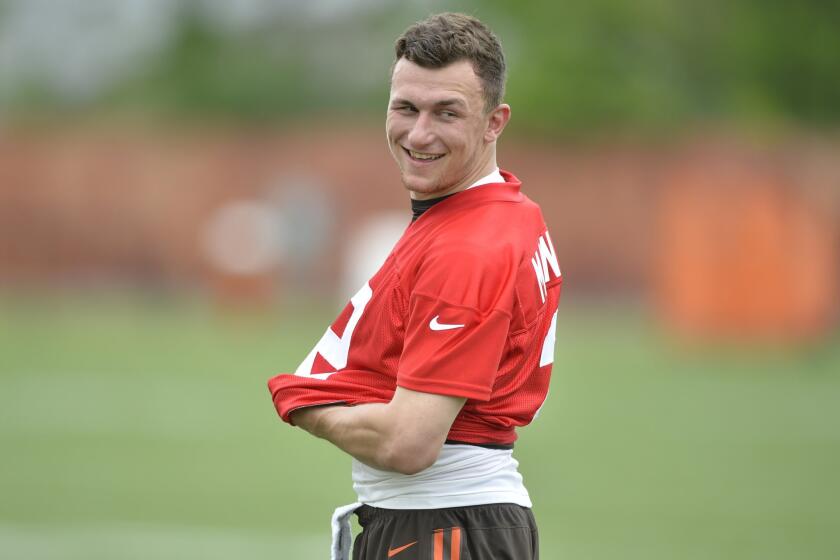 Cleveland Browns quarterback Johnny Manziel smiles during an OTA on Tuesday.