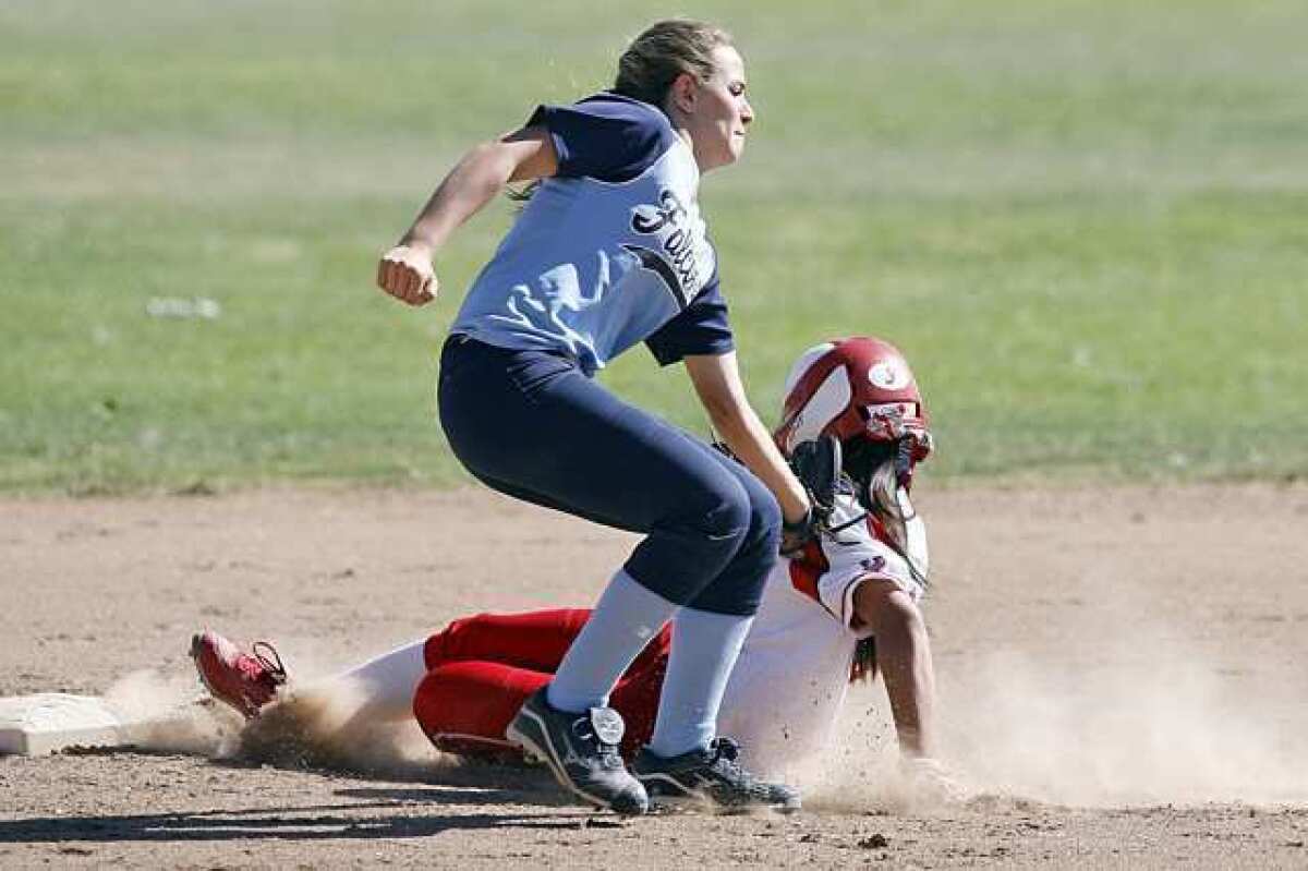 CV's Hailey Cookson, left, gets Burroughs' Sidney Ortega out at second base during a game at Olive Park in Burbank on Tuesday, April 9. 2013. (Cheryl A. Guerrero/Staff photographer)