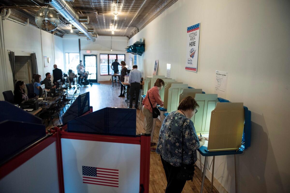 Balloting takes place at an early voting center in Minneapolis last week.