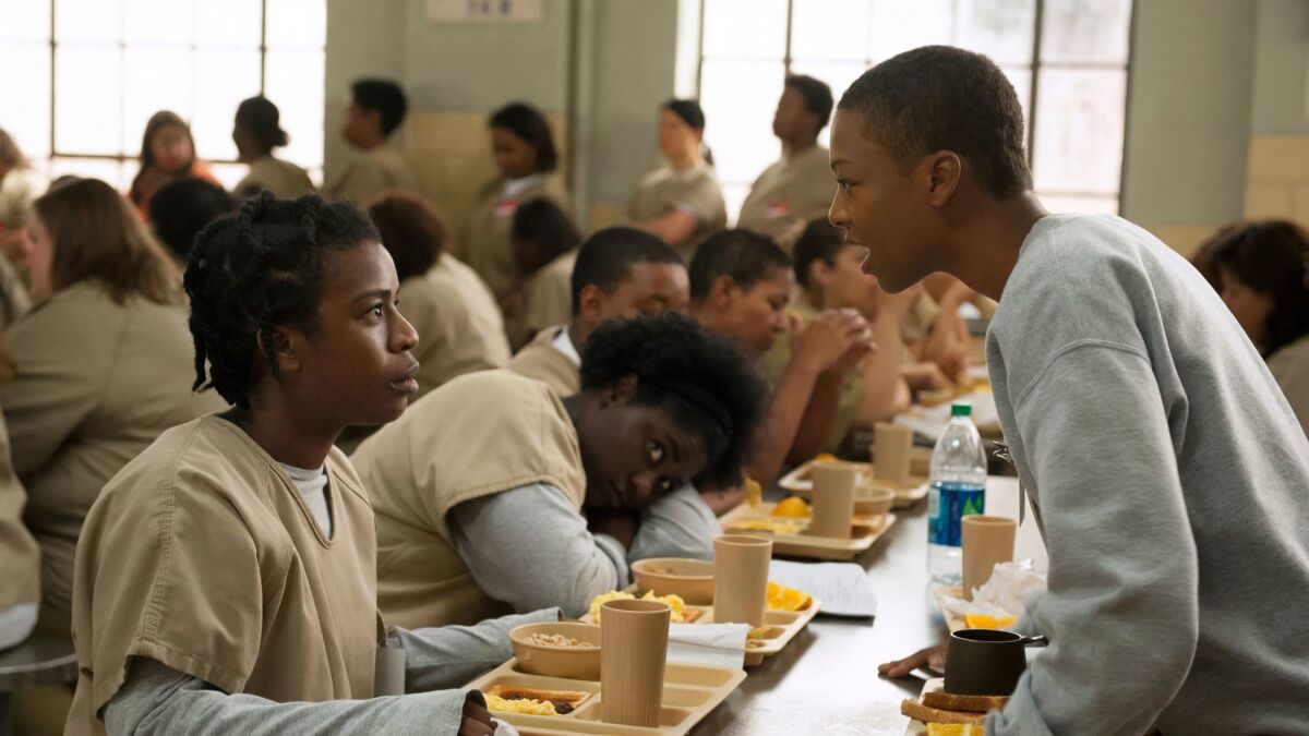 Uzo Aduba, left, and Samira Wiley appear in a scene from "Orange is the New Black."