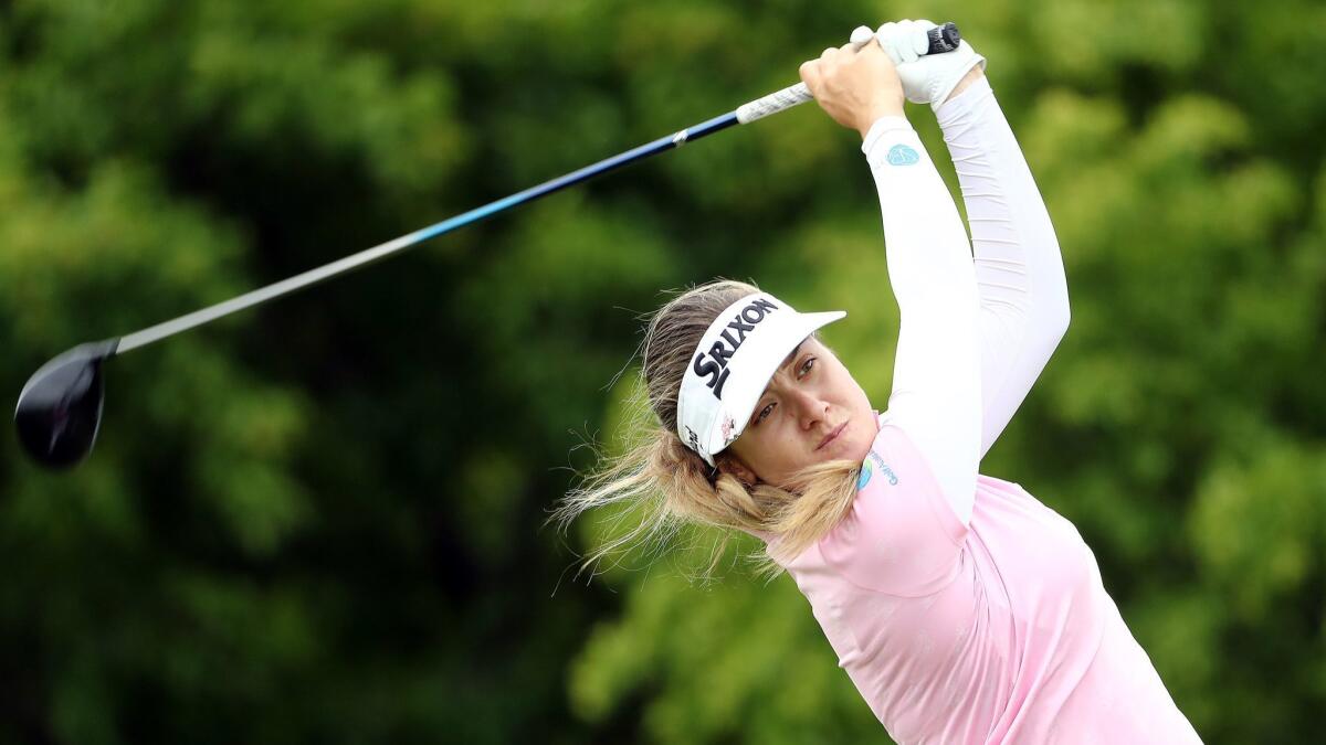 Hannah Green hits a third-round tee shot in the Women's PGA Championship at Hazeltine National in Chaska, Minn. The Australian shot a two-under-par 70 and is at nine-under 207.