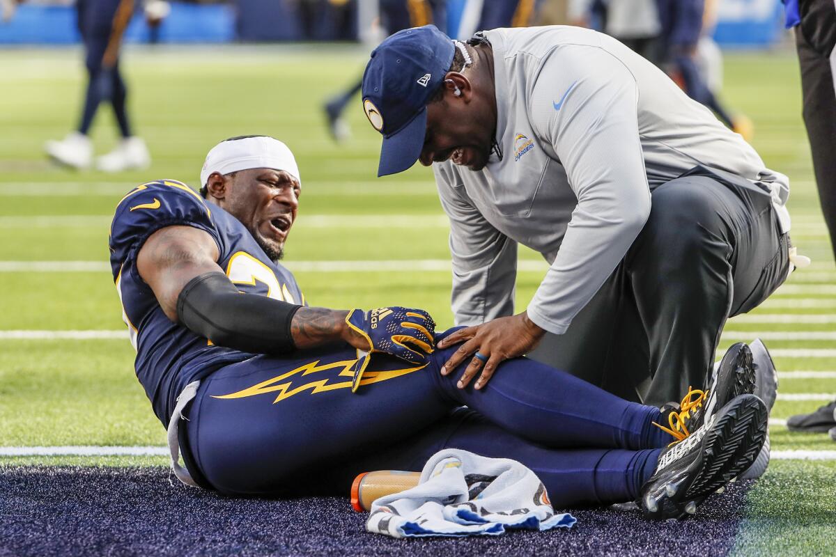 Chargers cornerback J.C. Jackson writhes in pain after injuring his knee late in the game against the Seattle Seahawks.