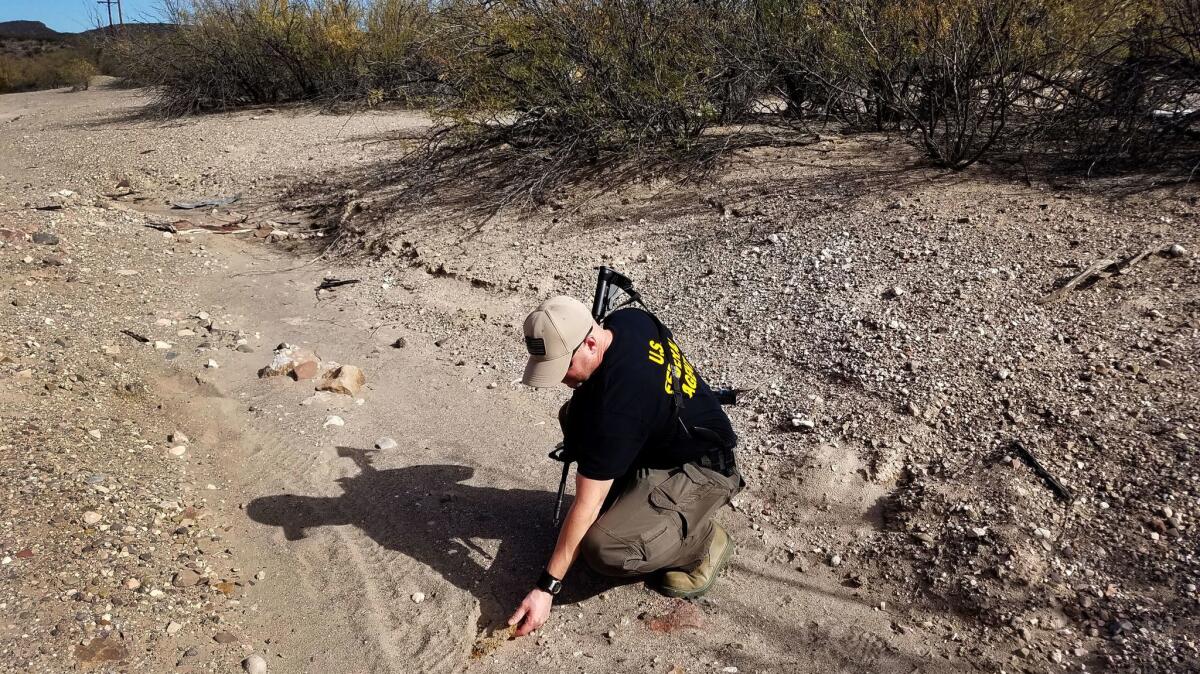 U.S. Customs and Border Protection Agent Aaron Bonsell checked signs of smuggling activity near the Rio Grande river in the Big Bend area last week: footprints with bits of carpet embedded, which smugglers use to hide their tracks.