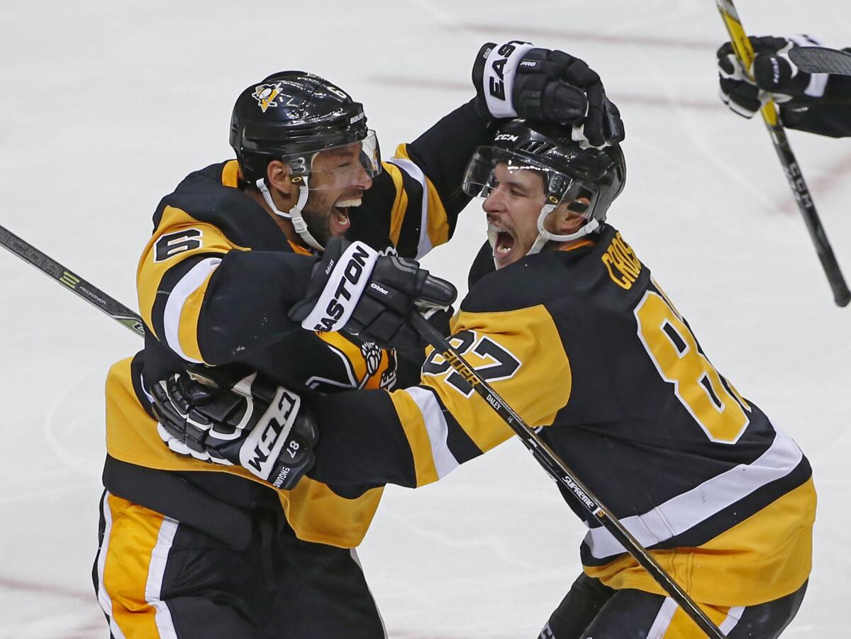 Penguins defenseman Trevor Daley (6) and forward Sidney Crosby (87) celebrate Patric Hornqvist's game-winning goal in overtime against the Capitals on May 4.