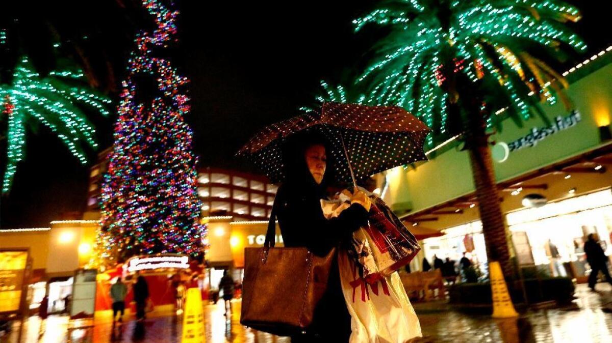 Christmas shoppers at Citadel Outlets in Commerce on Dec. 23. A new survey of consumer confidence in Los Angeles showed a sharp dip in the fourth quarter of 2016.