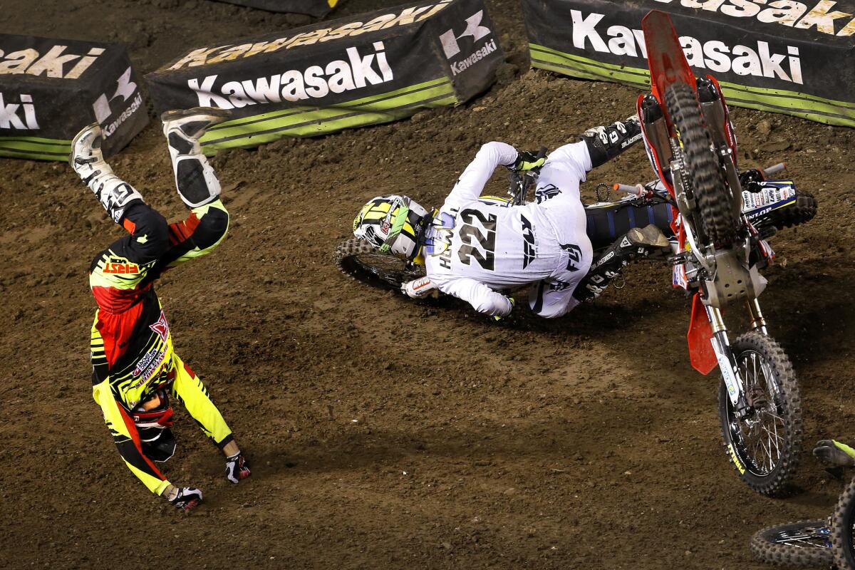 Thomas Do goes heels over head during a crash at the start of the 250SX qualifying heat race at the Monster Energy AMA Supercross at Angel Stadium on Jan. 23.