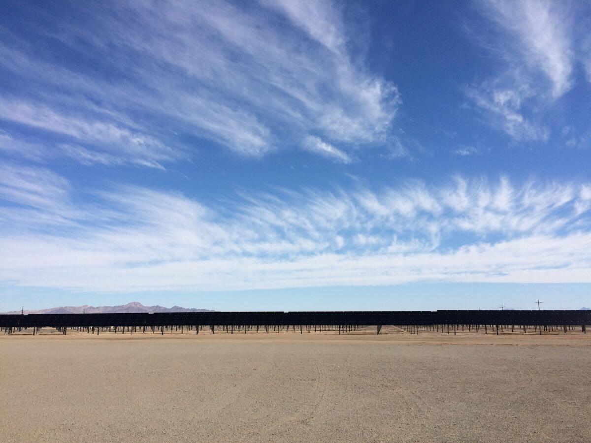 Solar panels tilt toward the sun at NextEra Energy's Blythe and McCoy solar farm in Riverside County.