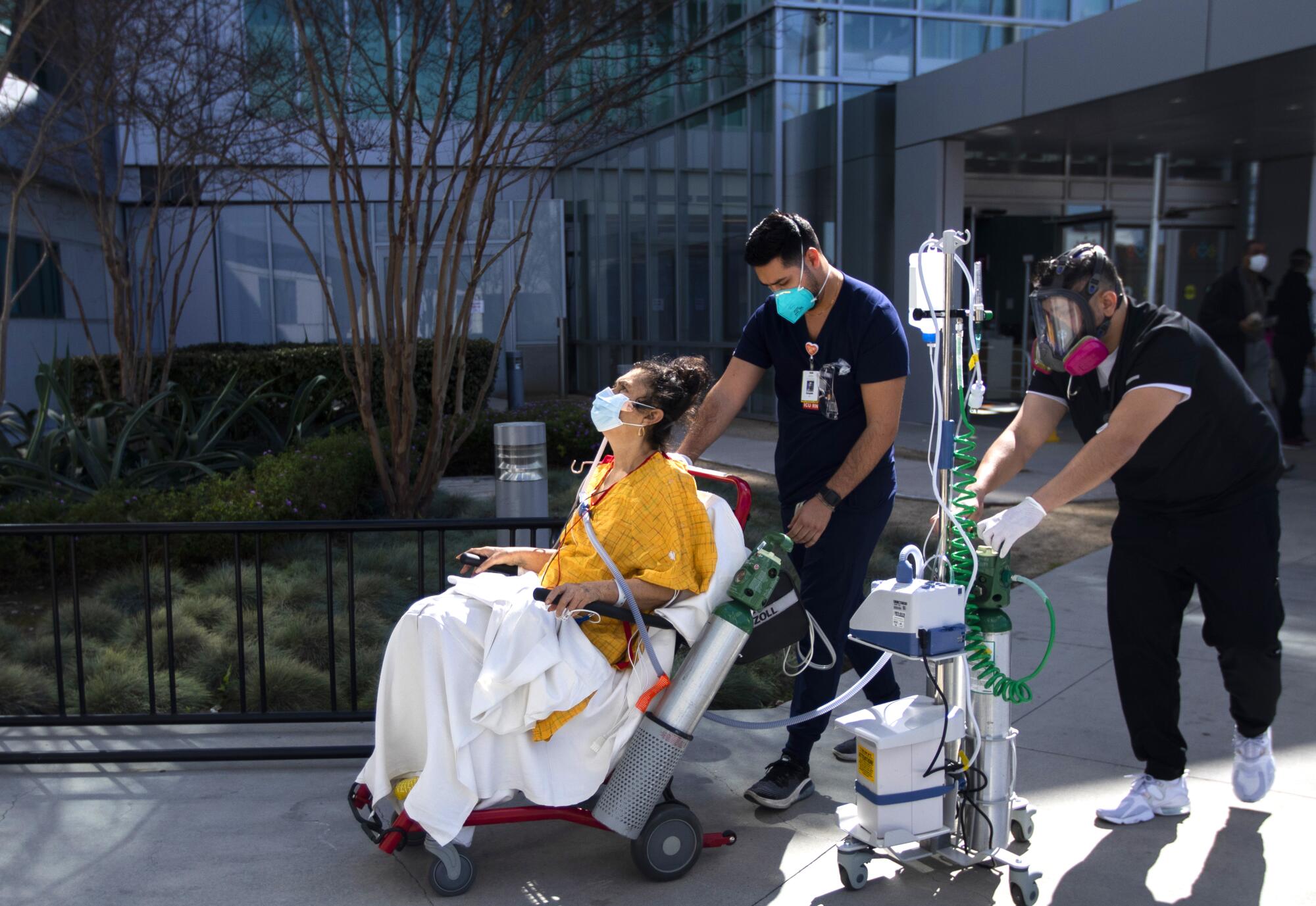 Eufemia Sanchez, 61, is wheeled outside Martin Luther King Jr. Community Hospital for fresh air.