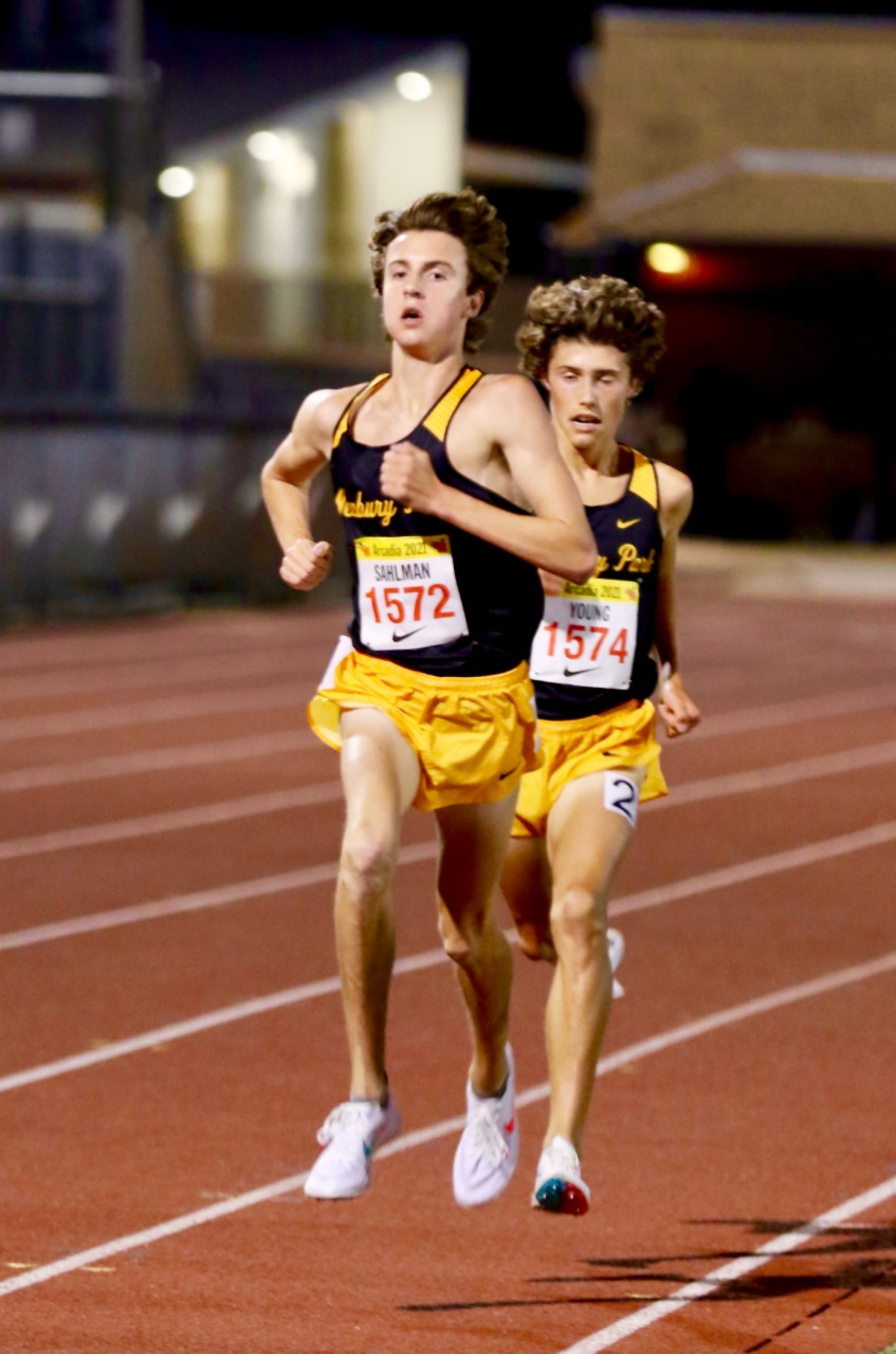 Colin Sahlman, a junior member of Newbury Park, sprints to the finish line on the left 