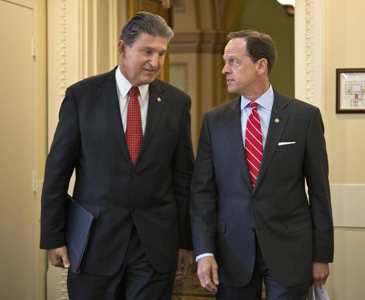 Sen. Joe Manchin (D-W.Va.) and Sen. Patrick Toomey (R-Pa.)