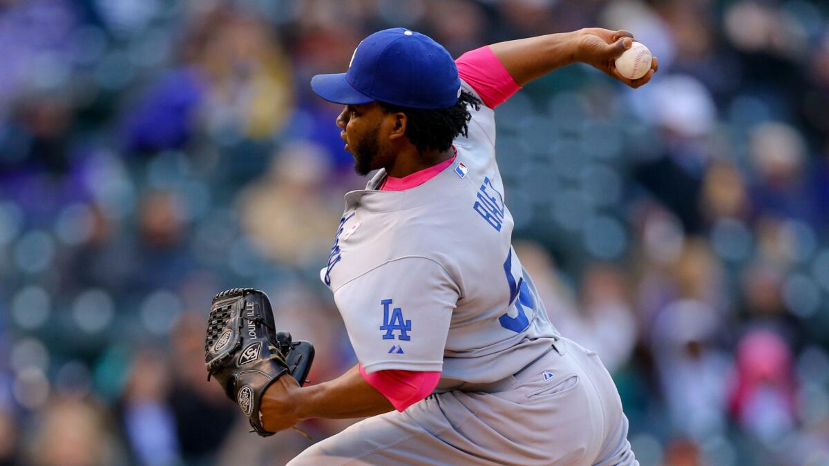 Dodgers reliever Pedro Baez delivers a pitch during a game May 10 against the Colorado Rockies at Coors Field in Denver.
