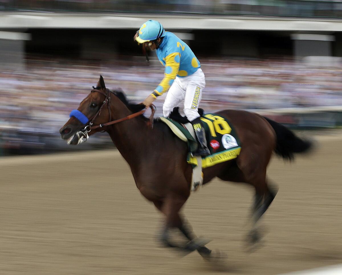 Victor Espinoza rides American Pharoah to victory in the 141st running of the Kentucky Derby horse race at Churchill Downs.
