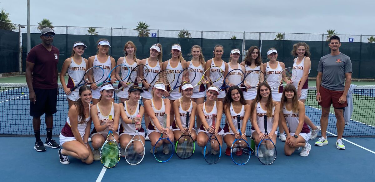 Members of the Point Loma High School girls varsity tennis team take time out from practice to pose for a photo.