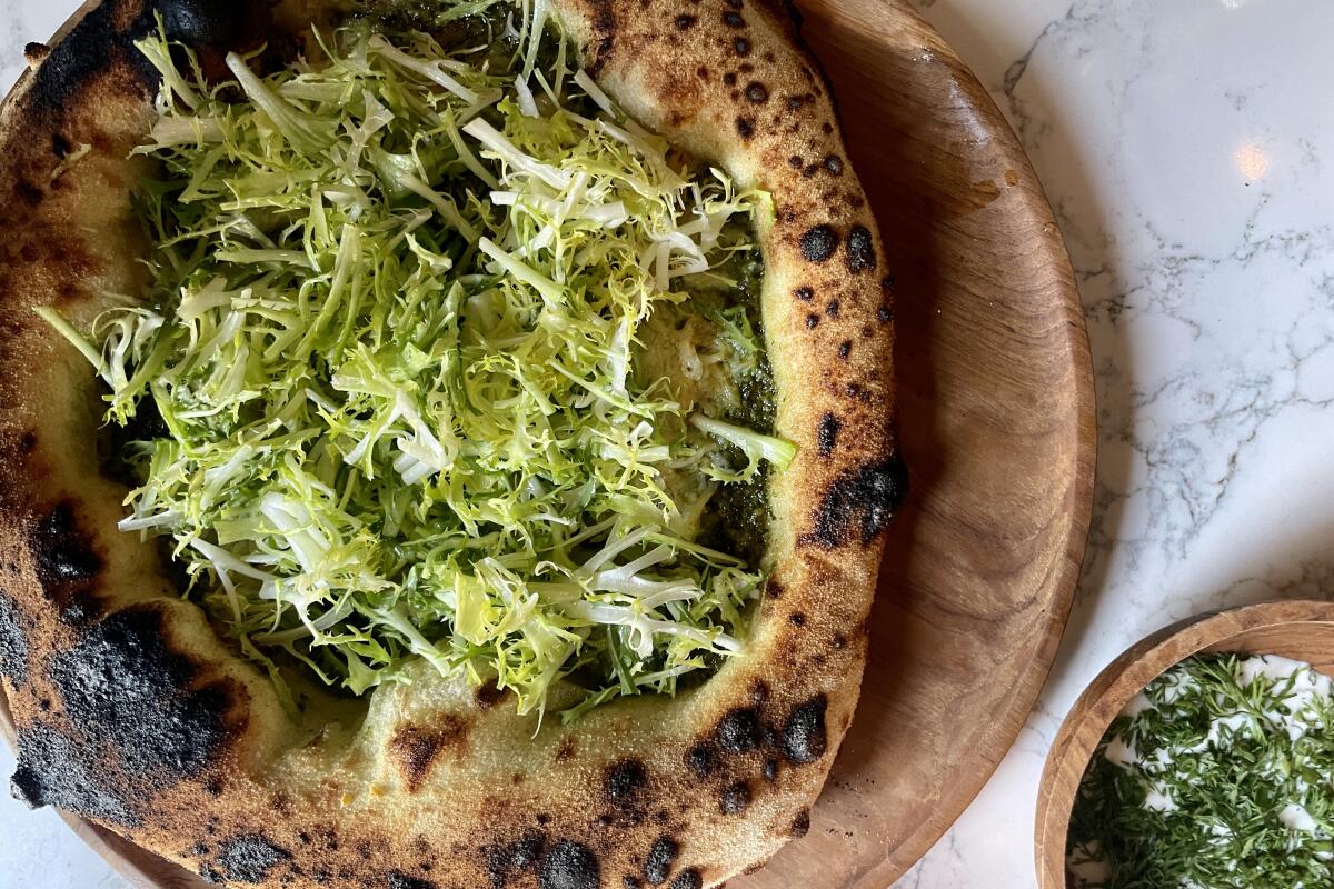 Crab and pesto pizza with a side of dill crème fraîche dip from Bar Monette in Santa Monica.