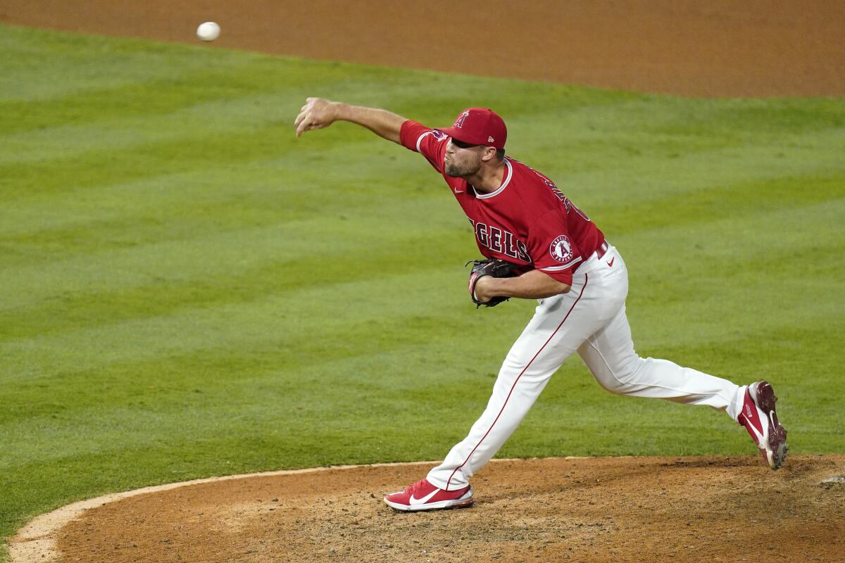Los Angeles Angels relief pitcher Hunter Strickland throws to the plate during the ninth inning of a baseball game against the Texas Rangers Tuesday, May 25, 2021, in Anaheim, Calif. (AP Photo/Mark J. Terrill)