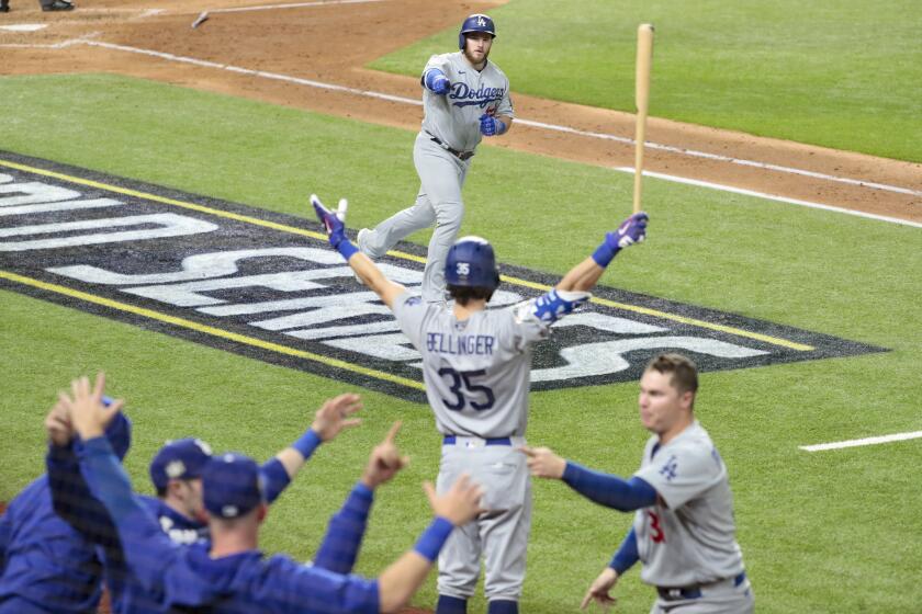 Arlington, Texas, Sunday, October 25, 2020 Max Muncy homers in the fifth inning in game five of the World Series at Globe Life Field. (Robert Gauthier/ Los Angeles Times)