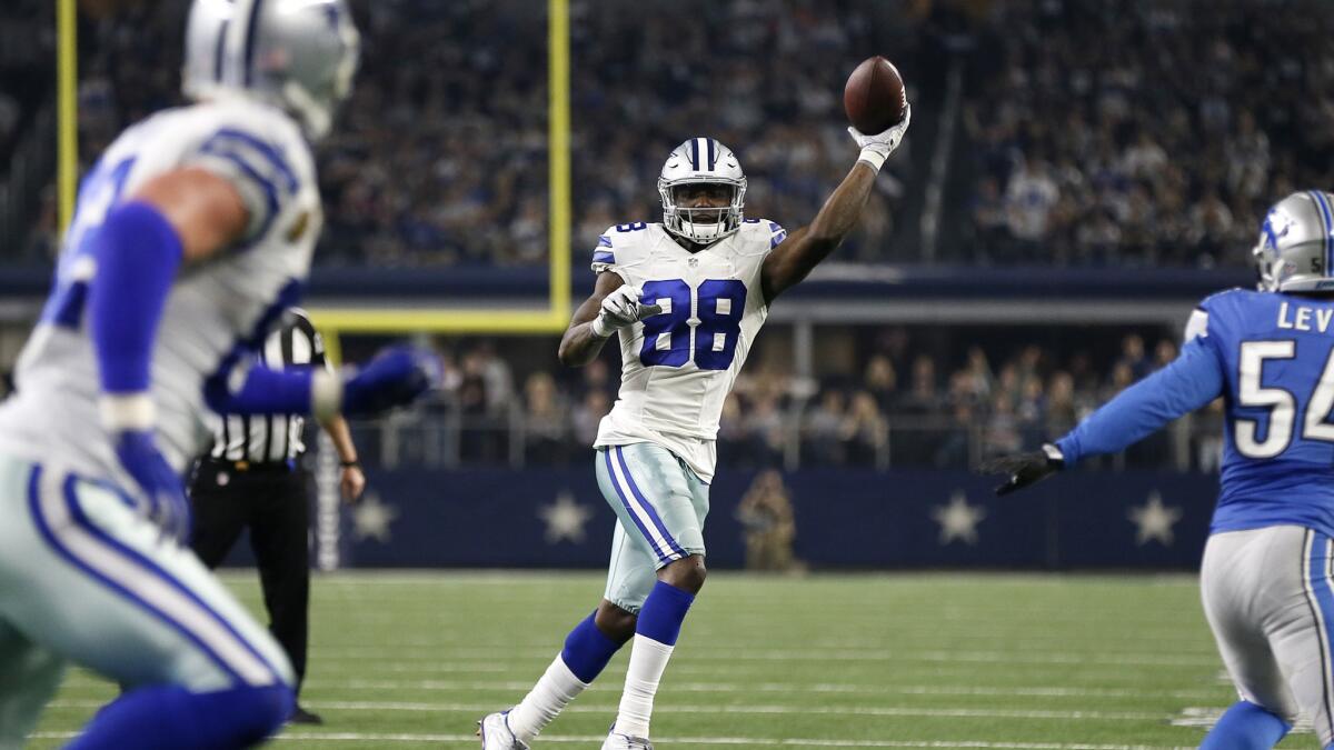 Cowboys receiver Dez Bryant (88) throws a touchdown pass to tight end Jason Witten, left, during the second half Monday.