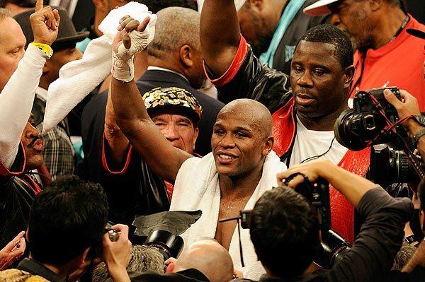 Floyd Mayweather Jr. celebrates after defeating Shane Mosley by unanimous decision in their WBA welterweight fight at the MGM Grand Garden Arena on Saturday night.