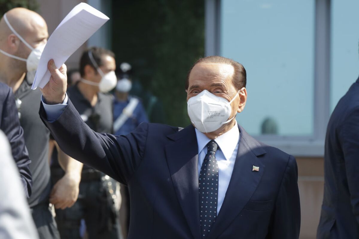 Former Italian Premier Silvio Berlusconi leaves the San Raffaele hospital in Milan, Italy, on Monday.
