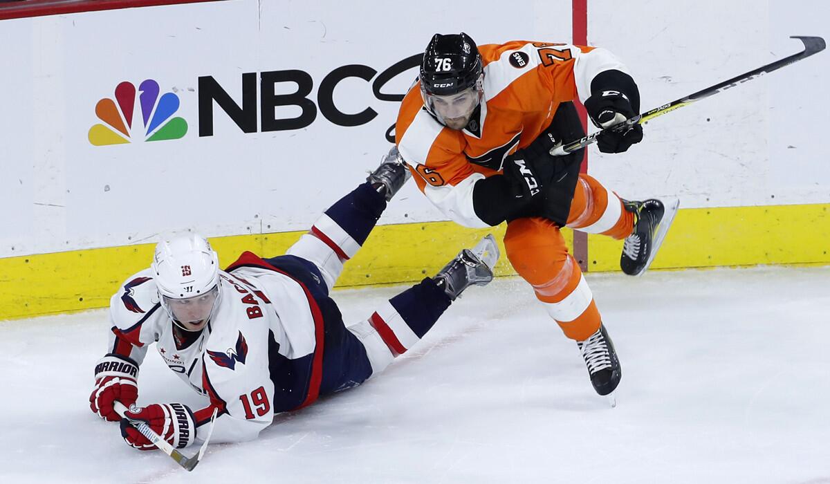 Philadelphia Flyers' Chris VandeVelde, right, checks Washington Capitals' Nicklas Backstrom during the third period of Game 4 in the first round of the Stanley Cup hockey playoffs on Wednesday.