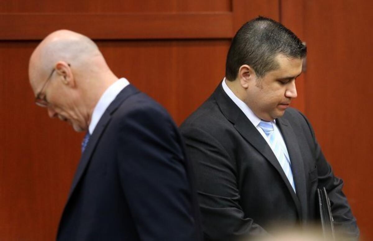 George Zimmerman, right, with defense attorney Don West, arrives at the Seminole County courthouse in Sanford, Fla., on Monday.