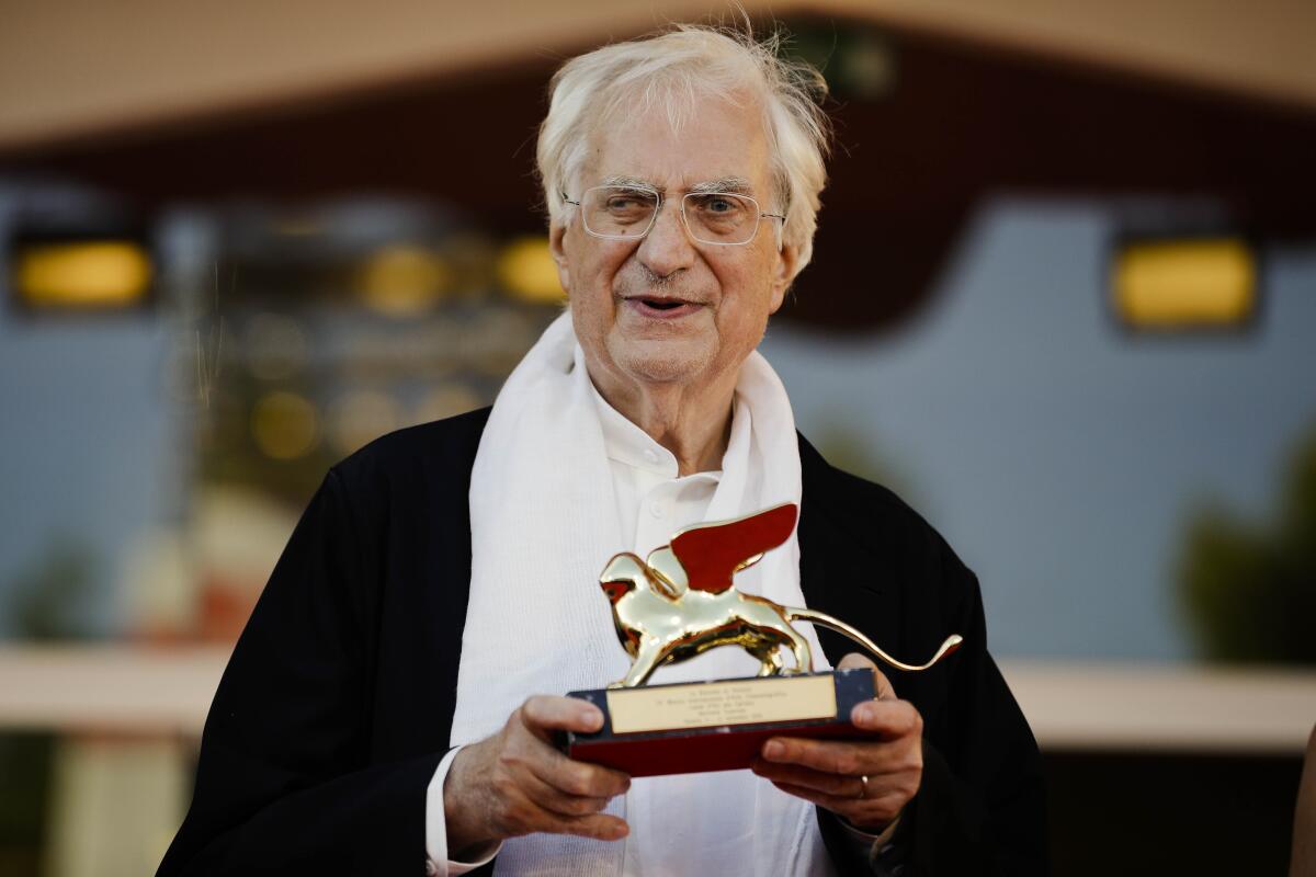 Bertrand Tavernier poses with a trophy.
