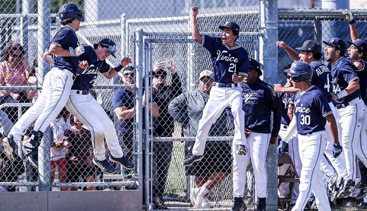 Venice's Canon King (left) gives a chest bump after his home run against Chatsworth.