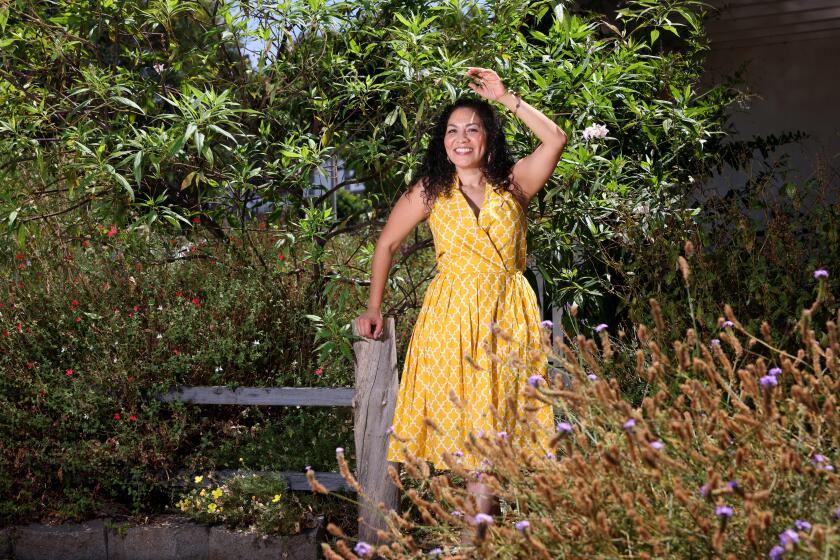 WHITTIER-CA-AUGUST 9, 2024: Aurora Anaya and her corner lot in Whittier filled with native plants are photographed on August 9, 2024. (Christina House / Los Angeles Times)