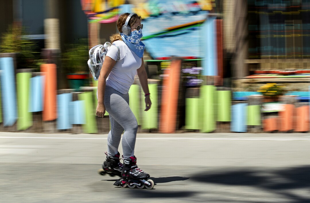 A rollerblader cruises down the boardwalk in Venice Beach.