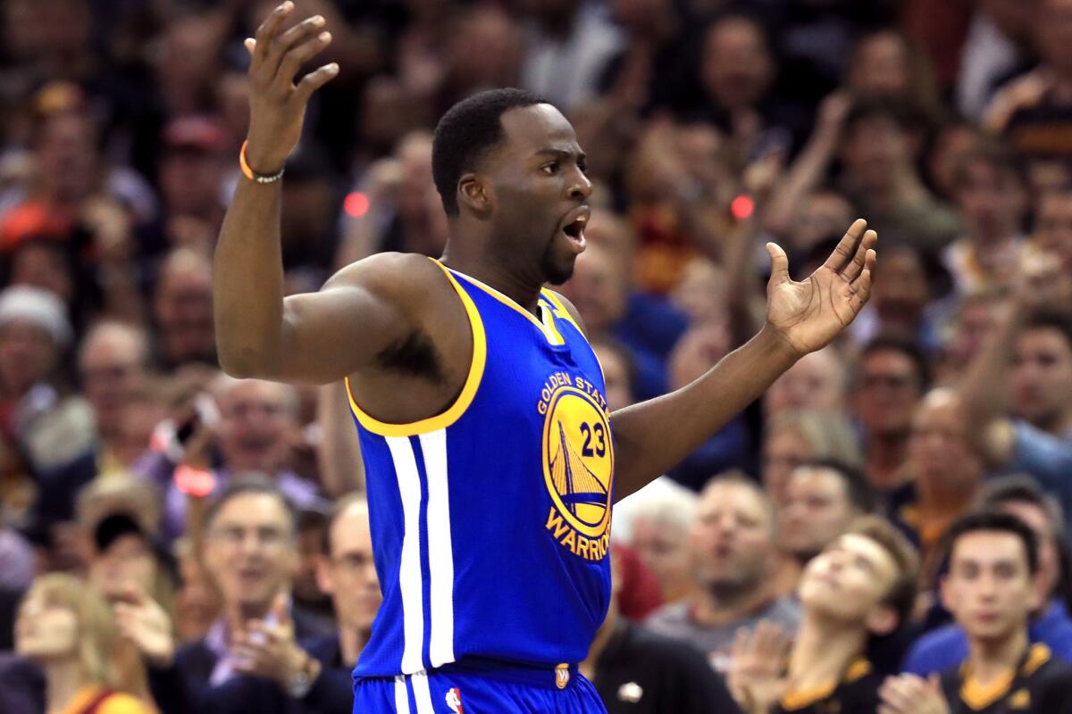 Warriors forward Draymond Green reacts to a foul call during the first half of Game 4 on Friday night.