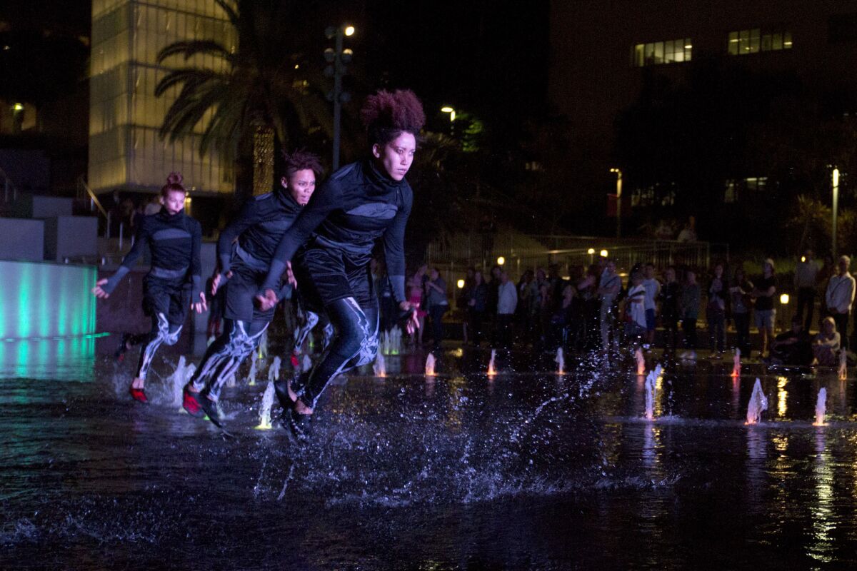 Decadancetheatre dancers perform "The Firebird" in the fountain in Grand Park.