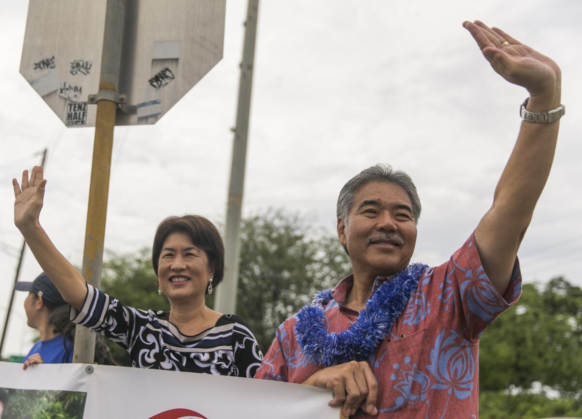 Hawaii State Sen. David Ige defeated Gov. Neil Abercrombie for the Democratic nomination for governor. Above, Ige doing some last-minute campaigning with his wife, Dawn.